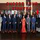 The cast of the latest season of The Bachelorette with the words choose your fighter above pointing to the one player in a cat costume.
